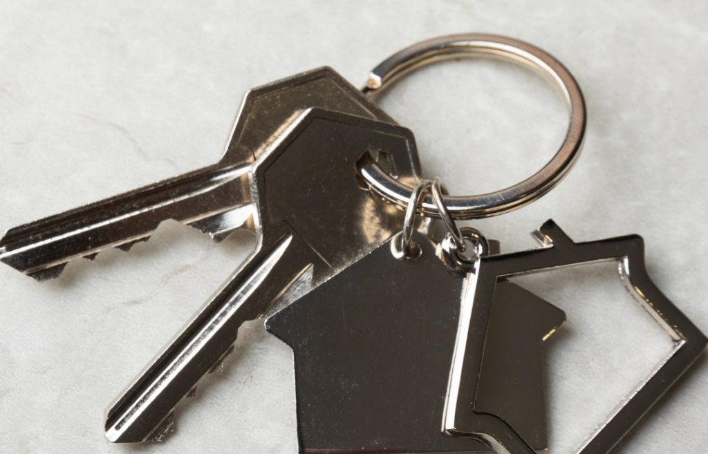 A set of keys with the words HousingPlus Blog listed