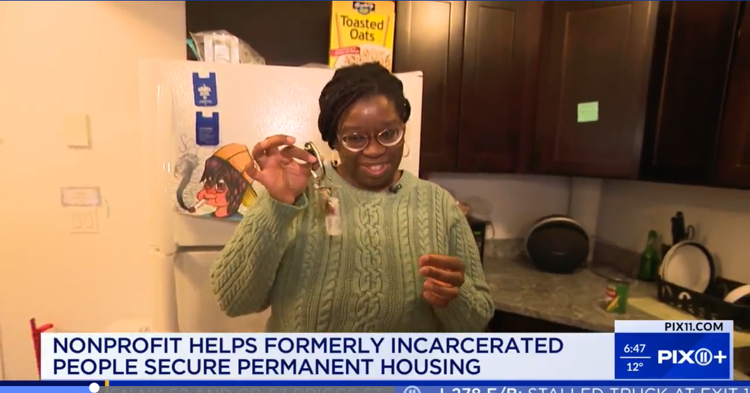 Transitional supportive housing client shows a set of house keys