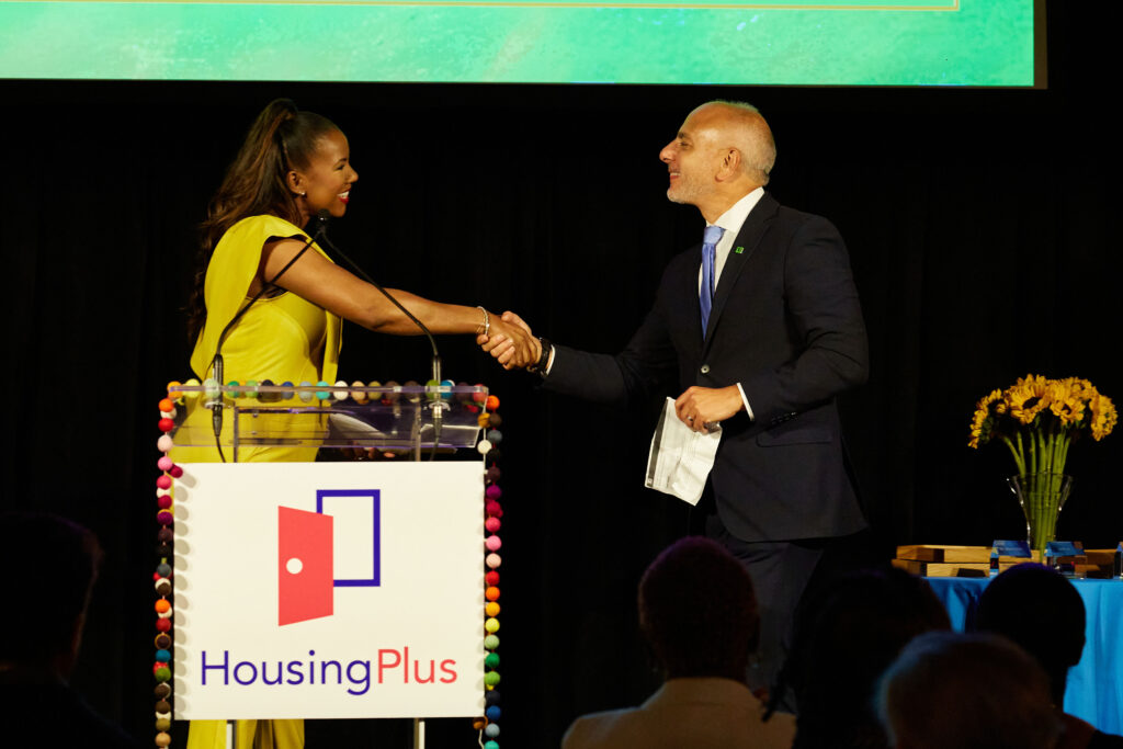 Vanessa Freeman shakes hands with a gentleman