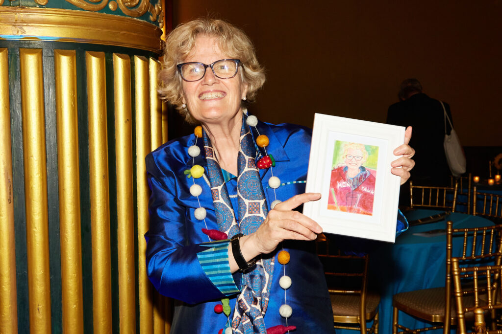 Woman holds a portrait