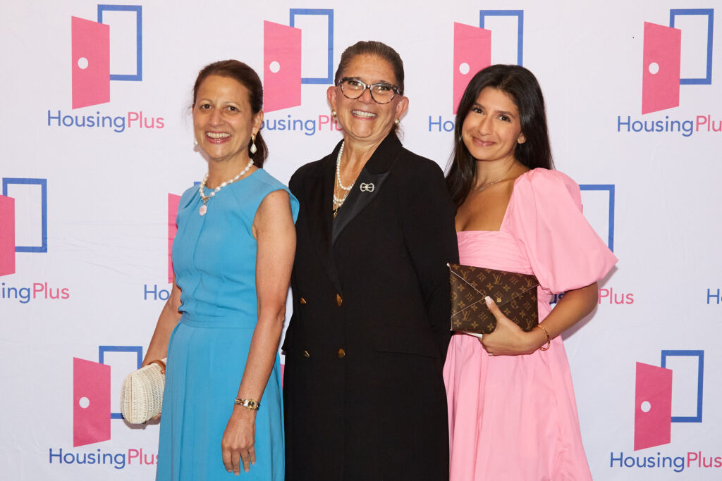 Three women face camera
