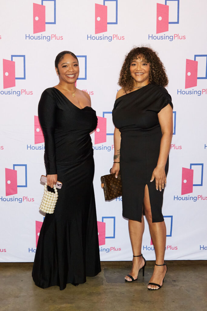 Two women in black dresses