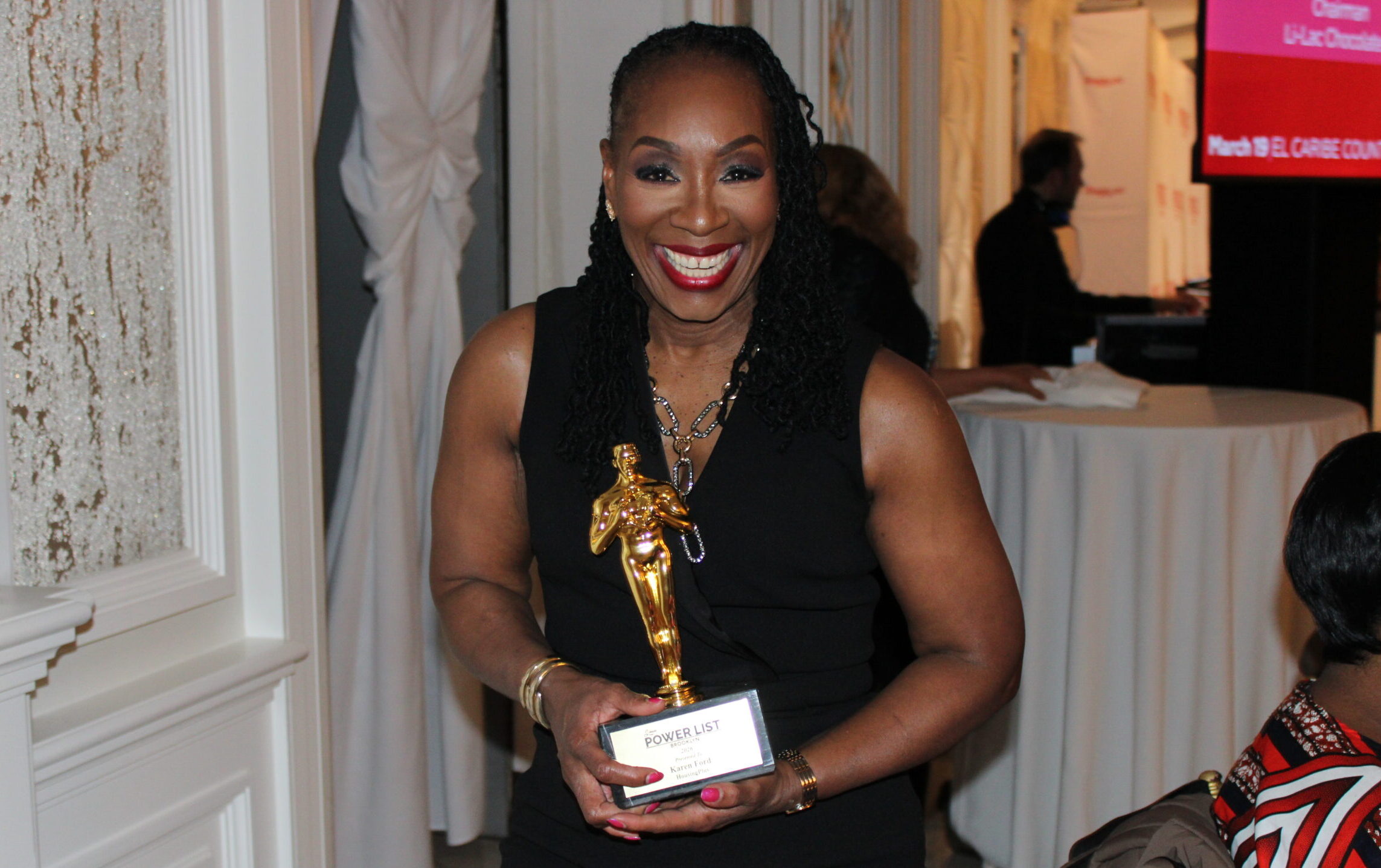 Karen Ford holding an award at the Brooklyn Power List Honoree Ceremony
